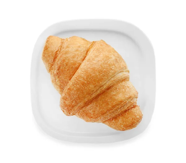 Assiette avec croissant savoureux sur fond blanc, vue de dessus — Photo