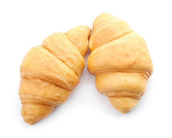 Croissants savoureux sur fond blanc — Photo