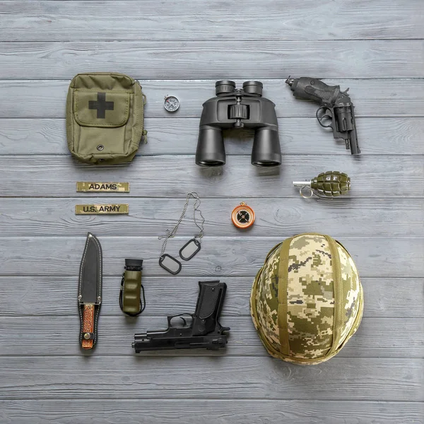 Set of military equipment on wooden background, flat lay — Stock Photo, Image