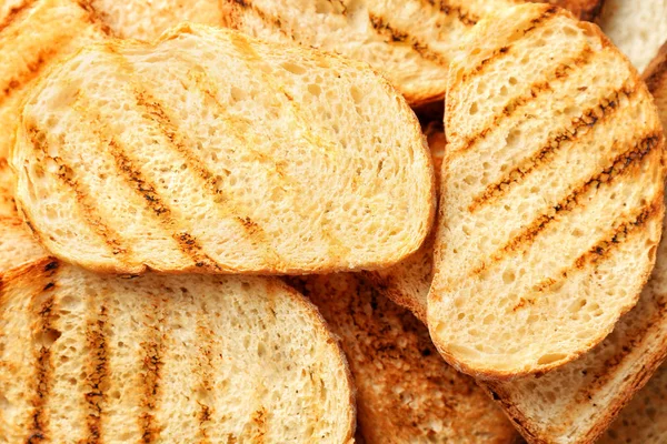 Підсмажені скибочки хліба як фон, крупним планом — стокове фото