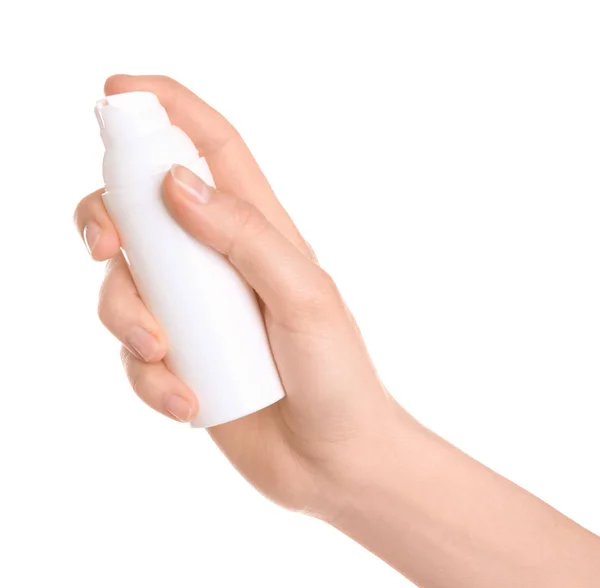 Young woman holding bottle with hand cream on white background — Stock Photo, Image