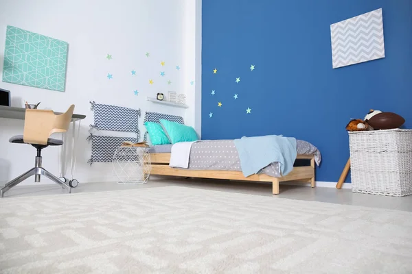 Modern child room interior with comfortable bed and desk — Stock Photo, Image