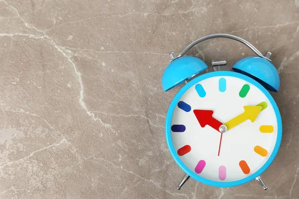 Blue alarm clock on table. Time change concept — Stock Photo, Image