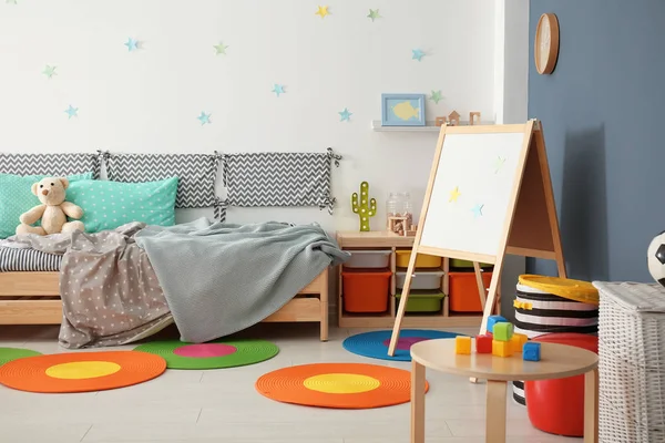 Modern child room interior with comfortable bed Royalty Free Stock Images