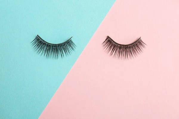 False eyelashes on color background — Stock Photo, Image