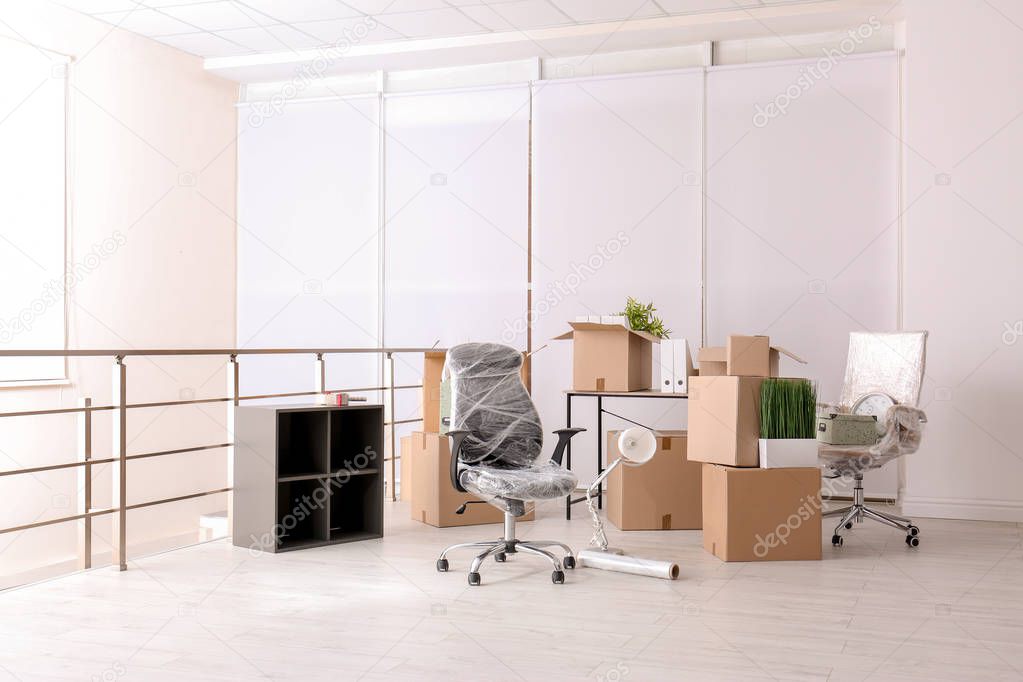 Carton boxes with stuff in room. Office move concept