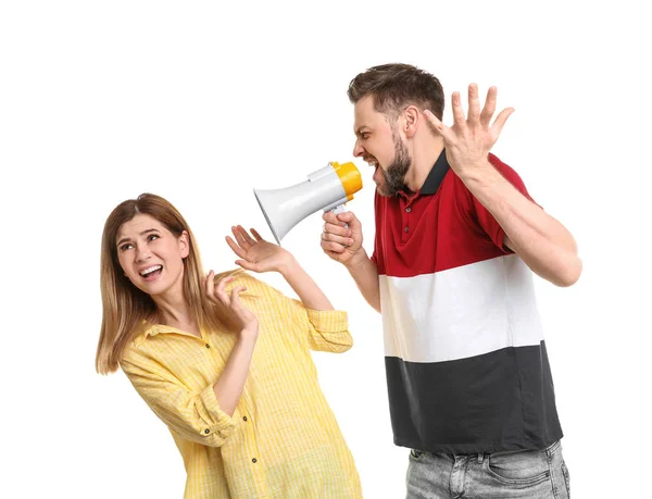 Jovem com megafone gritando com mulher no fundo branco — Fotografia de Stock