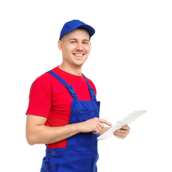 Encanador jovem com computador tablet em fundo branco — Fotografia de Stock