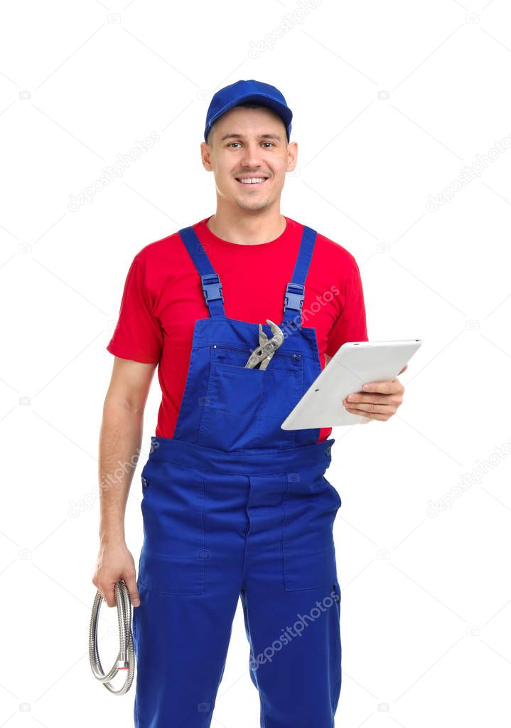 Young plumber with tablet computer on white background