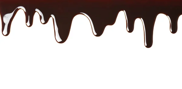 Pyszne rozpuszczoną czekoladą płynąca na białym tle — Zdjęcie stockowe
