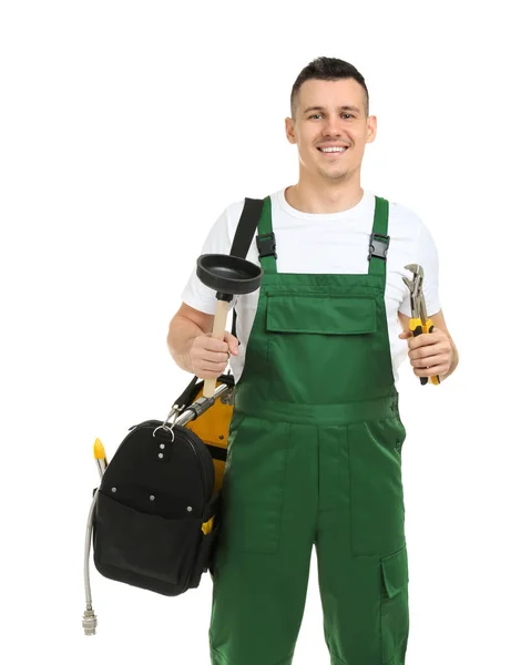 Young plumber with adjustable wrench and force cup on white background — Stock Photo, Image