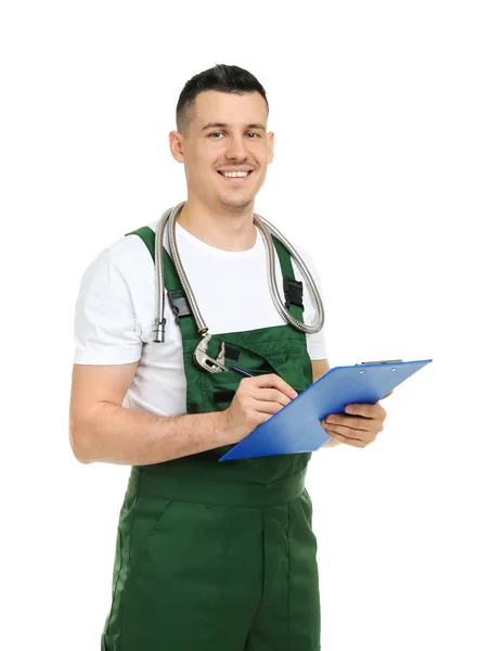 Young plumber with clipboard on white background — Stock Photo, Image