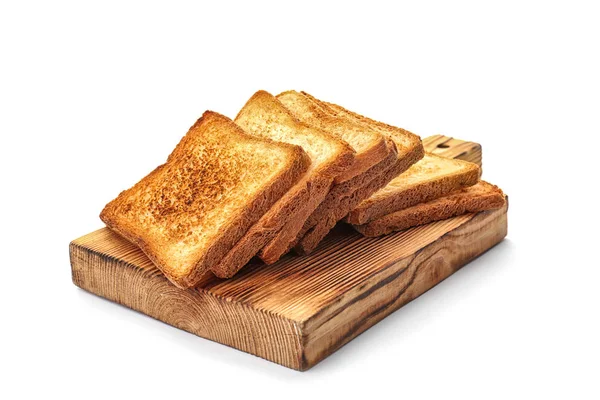 Ξύλινη σανίδα με φρυγανισμένο ψωμί σε λευκό φόντο — Φωτογραφία Αρχείου