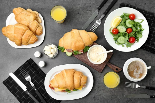 Tasty breakfast with fresh croissants on table, top view — Stock Photo, Image