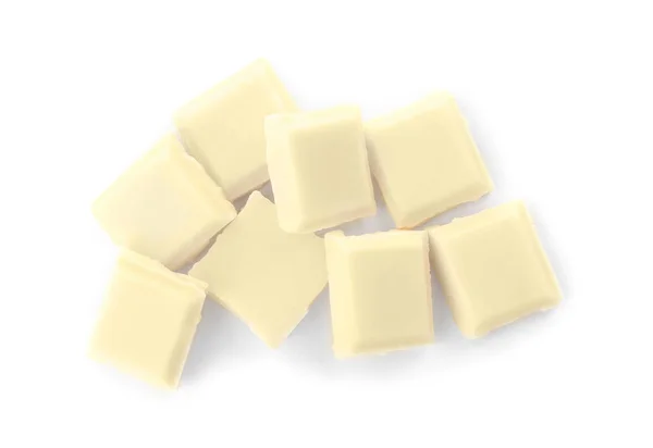 Köstliche Schokoladenstücke auf weißem Hintergrund, Draufsicht — Stockfoto