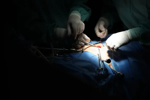 Medical team performing surgery in operating room, closeup — Stock Photo, Image