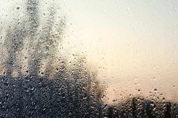 Gotas de chuva no vidro da janela como fundo, close-up — Fotografia de Stock