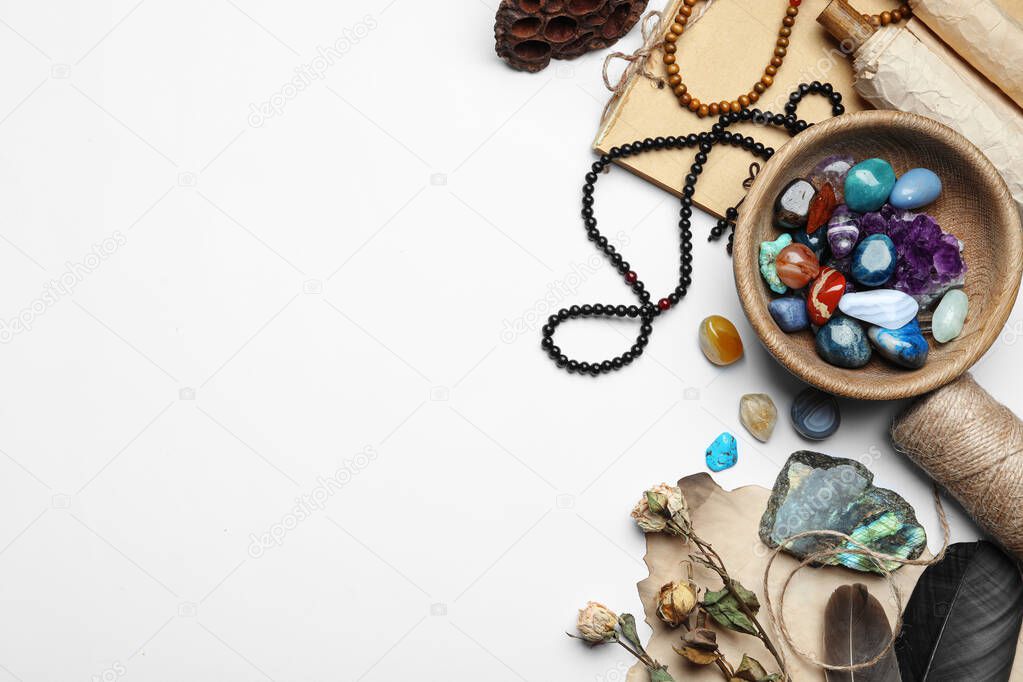 Composition with different gemstones on white background, top view