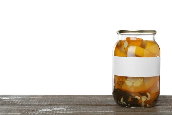 Jar of pickled yellow sliced zucchini with blank label on wooden table against white background. Space for text — Stock Photo, Image