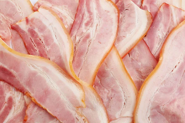 Slices of raw bacon as background, top view — Stock Photo, Image