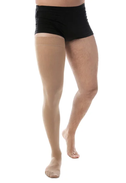 Man wearing compression stocking isolated on white, closeup — ストック写真