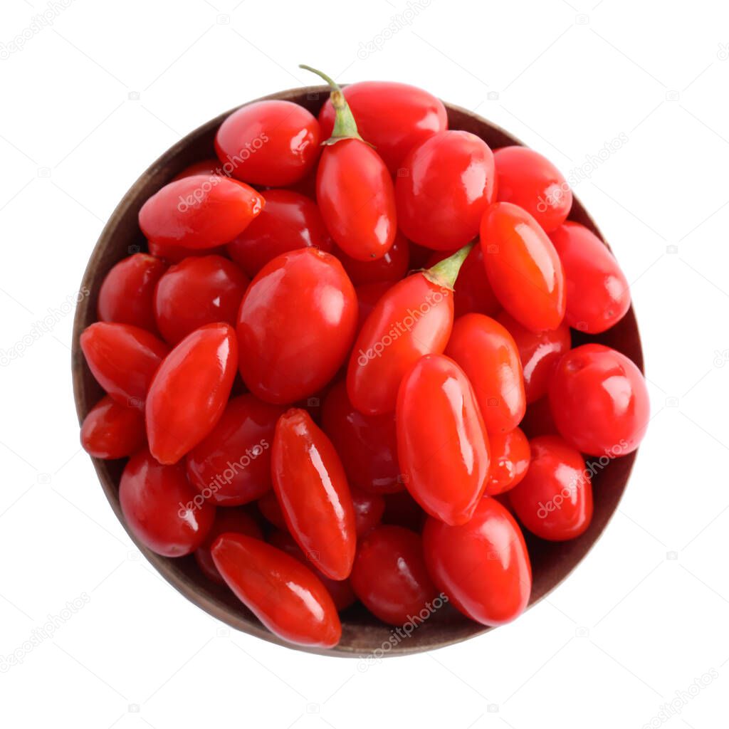 Fresh ripe goji berries in wooden bowl on white background, top view