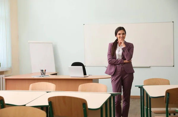 Portrait of female teacher in modern classroom — Stock Photo, Image