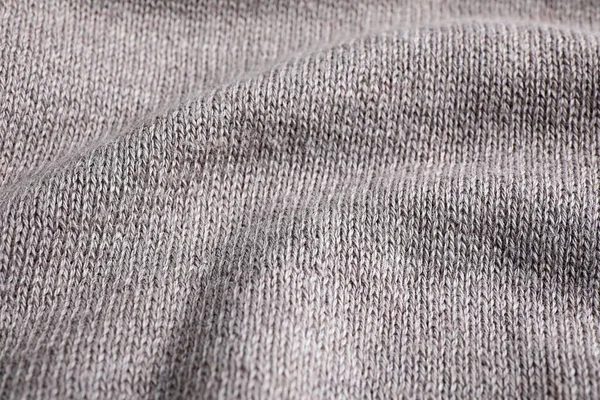 Γκρι πλεκτό πουλόβερ ως φόντο, προβολή closeup — Φωτογραφία Αρχείου