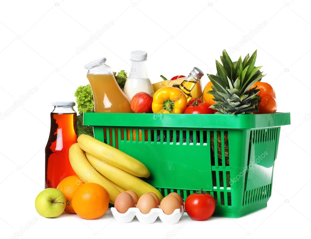 Shopping basket and grocery products on white background