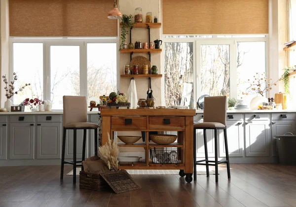 Stylish kitchen interior with wooden table and chairs — Stock Photo, Image