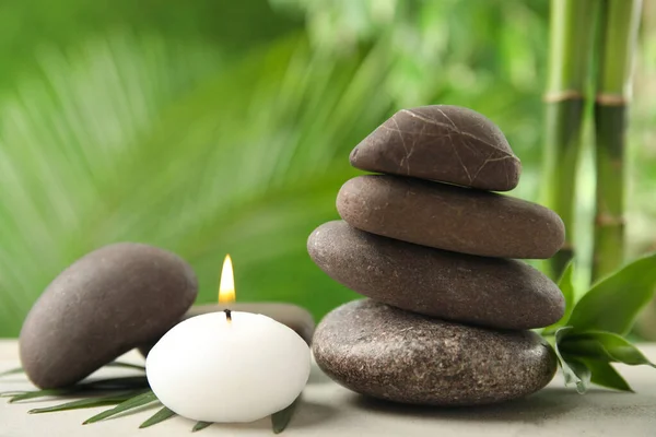 Composition with stones on table against blurred background. Zen concept — Stock Photo, Image