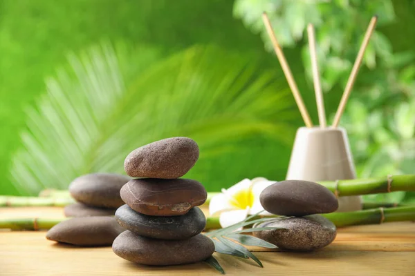 Composition with stones on table against blurred background. Zen concept — Stock Photo, Image