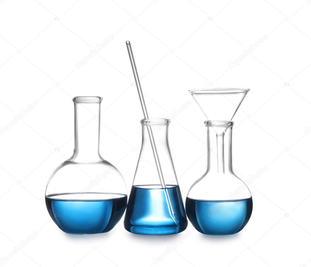 Set of laboratory glassware with blue liquid isolated on white