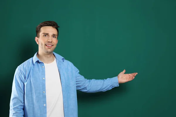 Portrait of male teacher on color background — Stock Photo, Image