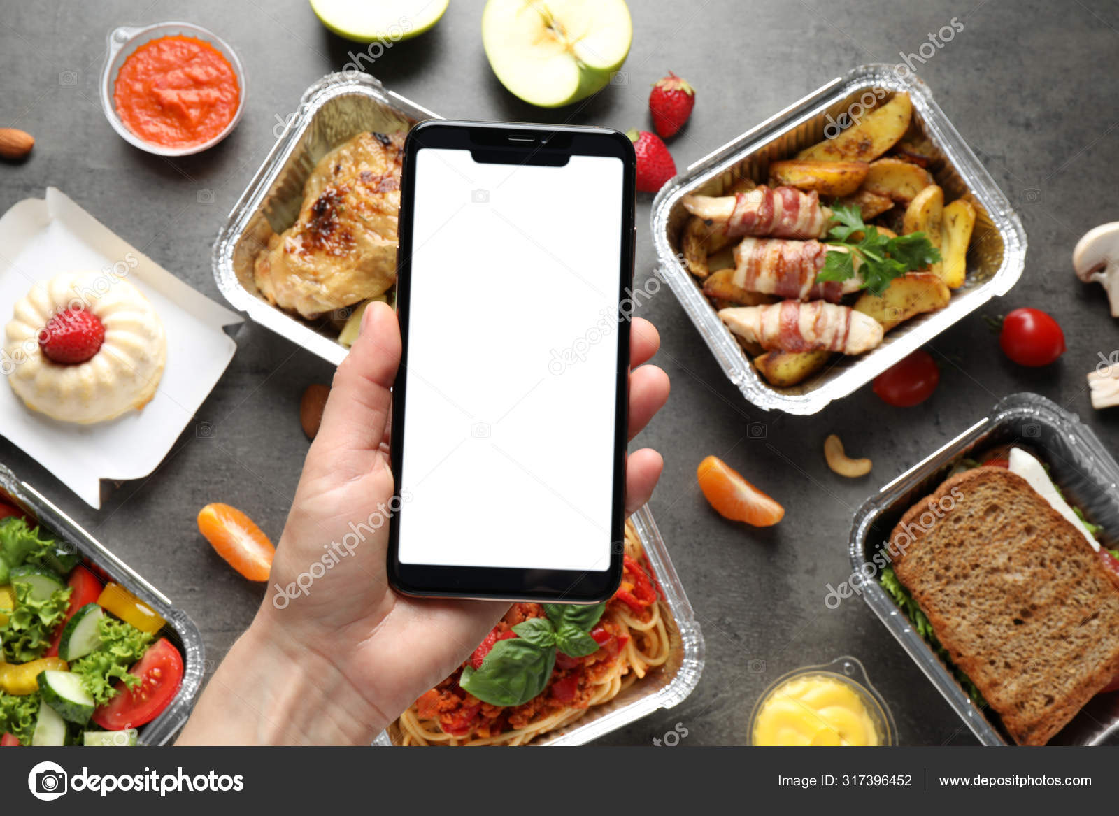 Download Top View Of Woman Holding Smartphone Over Grey Table With Lunchboxes Mockup For Design Healthy Food Delivery Stock Photo By C Newafrica 317396452