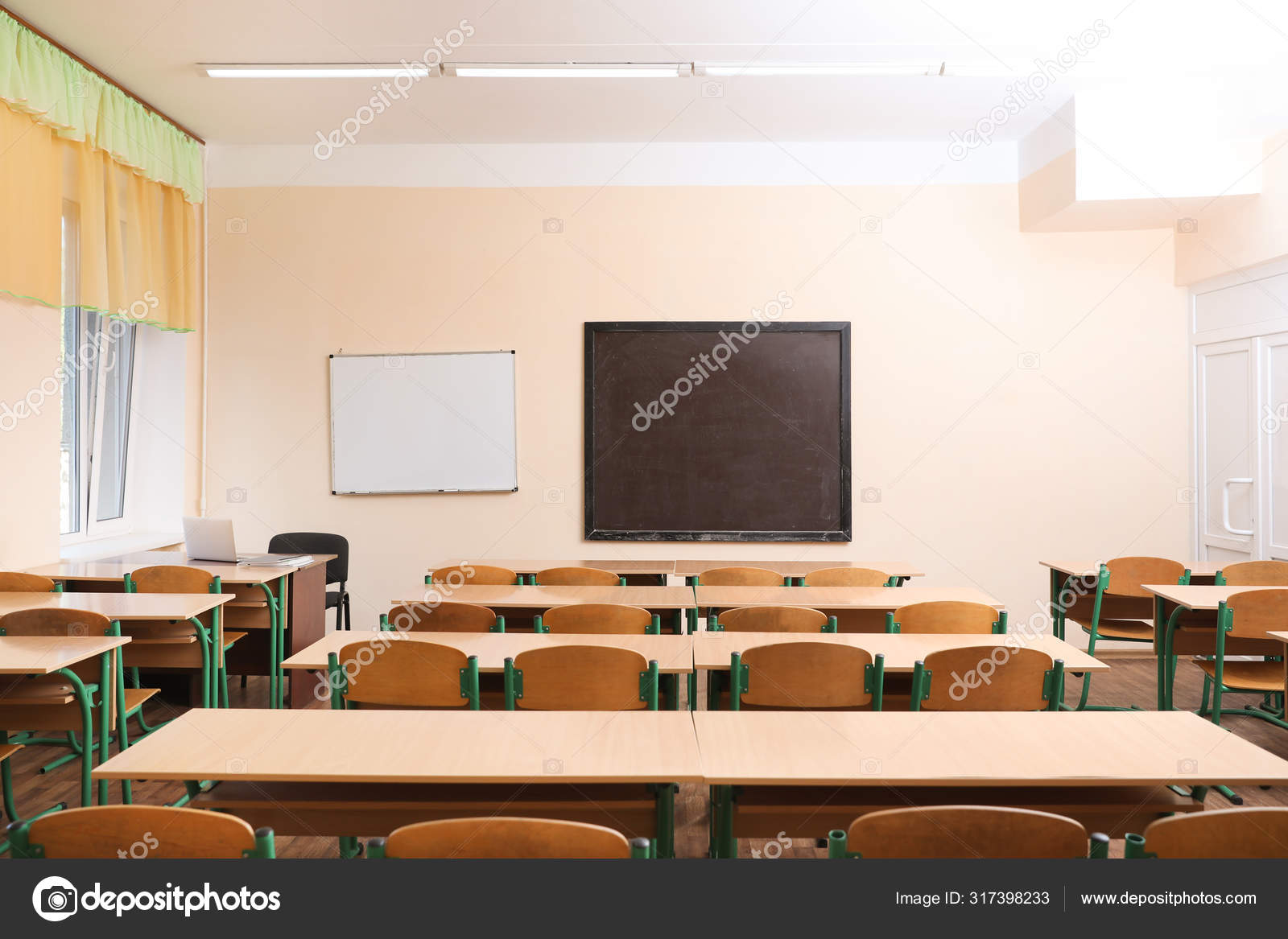 View of empty modern classroom at school Stock Photo by ©NewAfrica 317398233