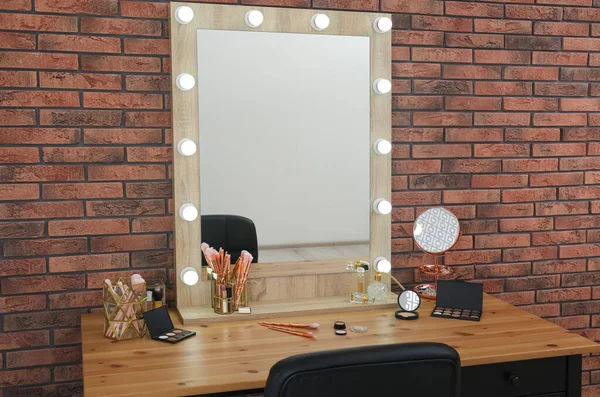 Dressing table with mirror in makeup room interior