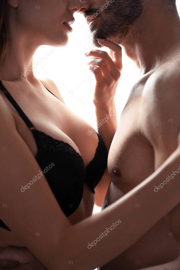 Passionate young couple at home, closeup view