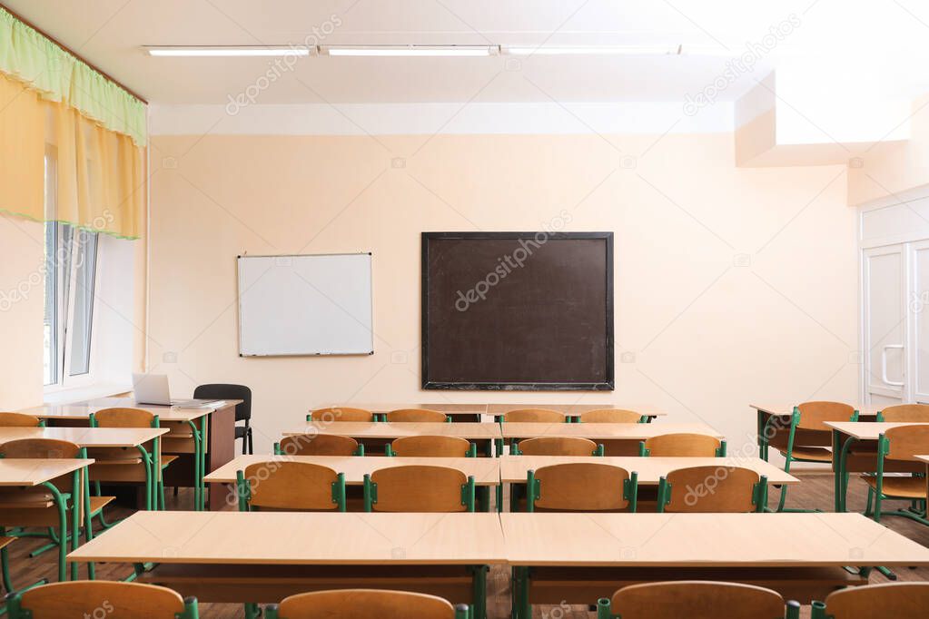 View of empty modern classroom at school