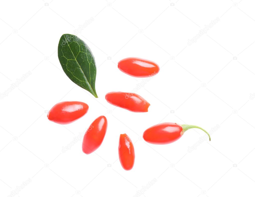 Fresh ripe goji berries and leaf on white background, top view