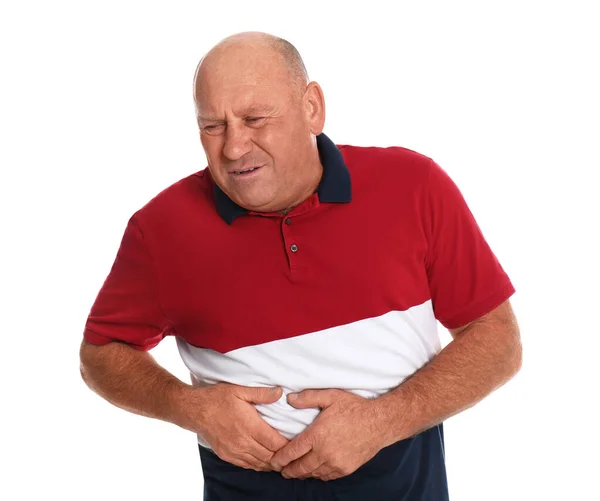 Homem maduro que sofre de dor no fígado em fundo branco — Fotografia de Stock