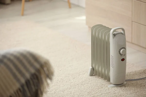 Modern electric heater on floor at home — Stock Photo, Image