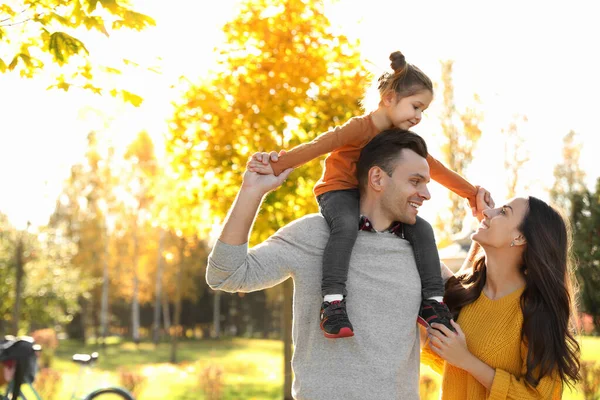 Happy family with little daughter in park. Autumn walk — Stock Photo, Image