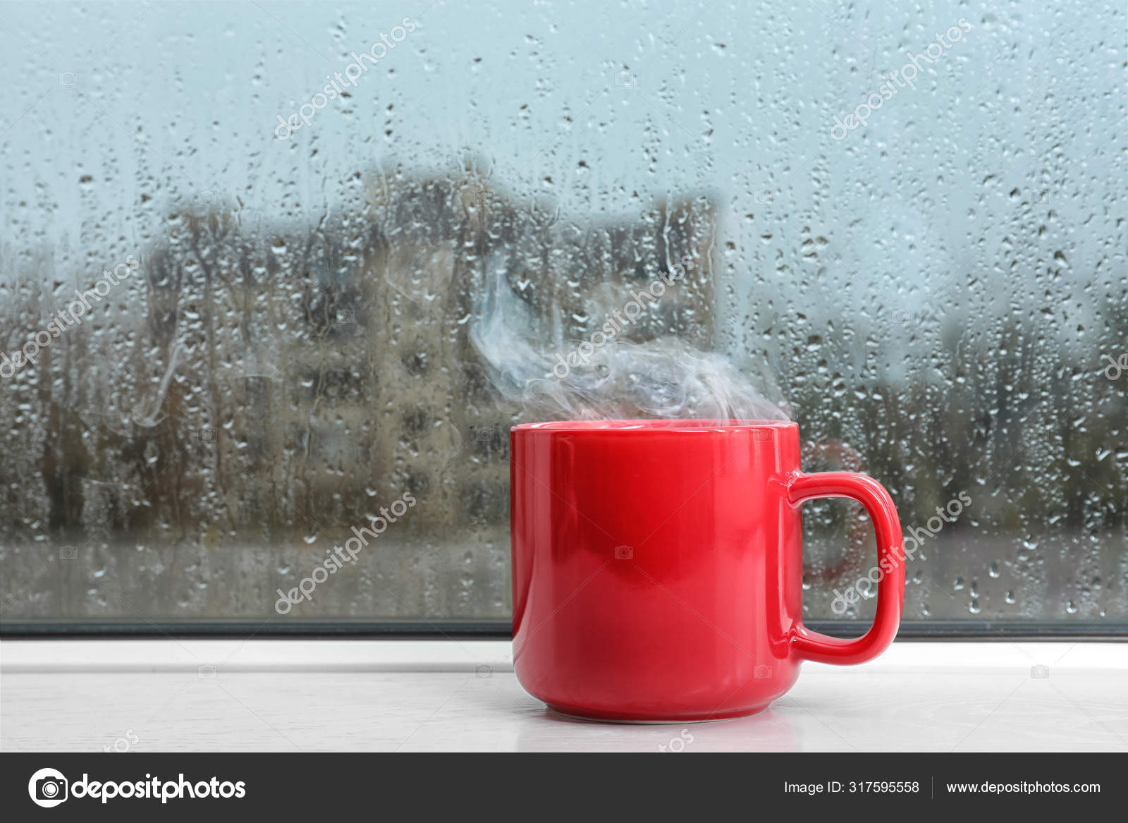 Cup of hot drink on white windowsill. Rainy weather Stock Photo by ...