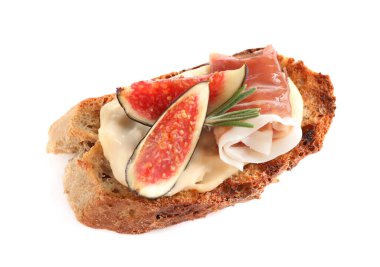 Bruschetta with cream cheese, prosciutto and figs isolated on white, above view