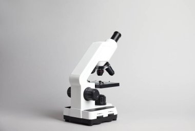 Modern microscope on grey background. Medical equipment