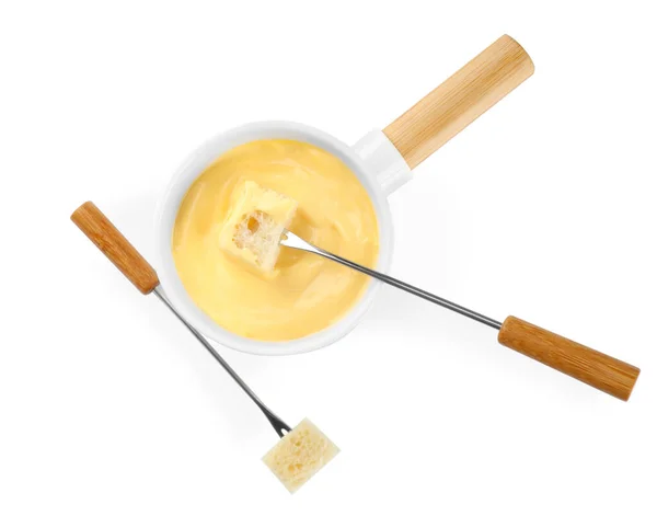 Pot of tasty cheese fondue and forks isolated on white, top view — Stock Photo, Image