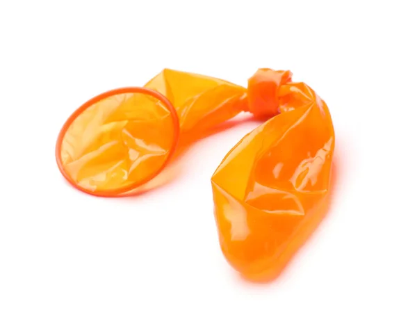 Orange used condom on white background. Safe sex concept — ストック写真