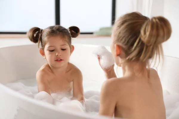 Cute Little Sisters Taking Bubble Bath Together — Stock Photo, Image