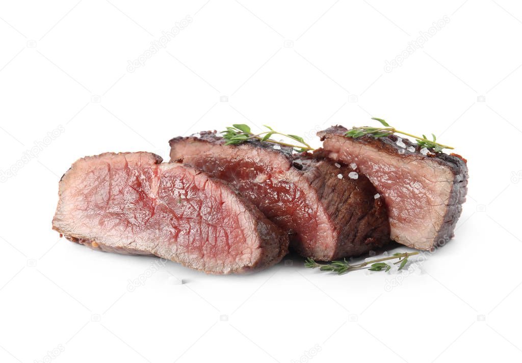 Delicious sliced beef steak with thyme and salt isolated on white